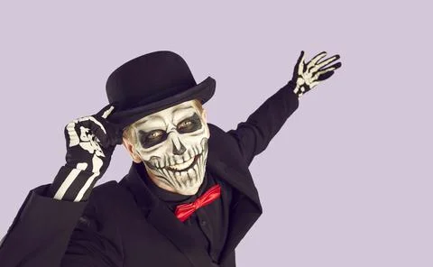 Skeleton man in studio isolated on lilac background Stock Photos