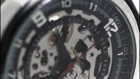 Skeleton Mechanical Wristwatch with Visible Gears and Red Second Hand Stock Footage 325853750