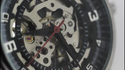 Skeleton Mechanical Wristwatch with Visible Gears and Red Second Hand Stock Footage 325853751
