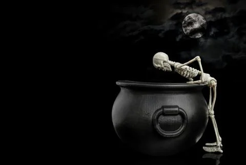 Skeleton Peaking In Cauldron Stock Photos