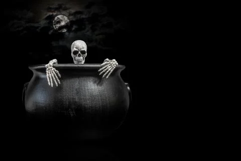 Skeleton Peaking Out of Cauldron Stock Photos