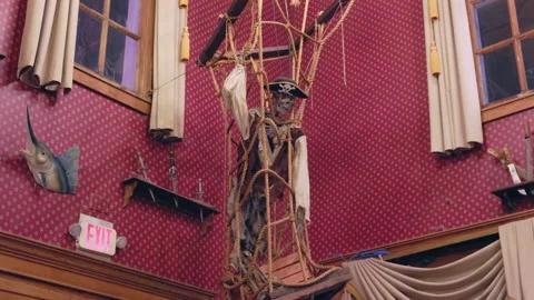 Skeleton of a pirate in his cage inside the lost pirate ship Vídeos de archivo 235391245