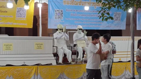 Skeleton props on white coffins at Inthakin Festival coffin donation Chiang Mai Stock Footage 336946514