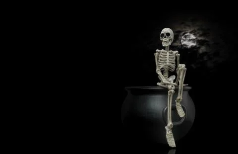 Skeleton Sitting On Cauldron Stock Photos