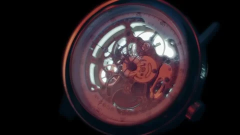 The skeleton watches reflect bright flashes, in tact with the time they count Video stock 314167324
