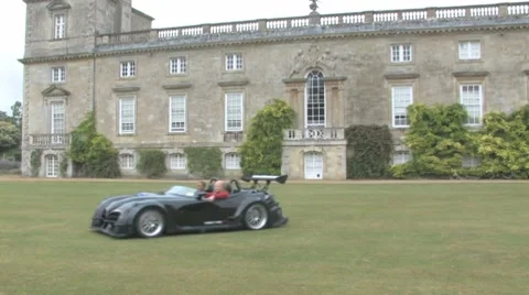 Skelta driving on lawn Stock Footage 8647474