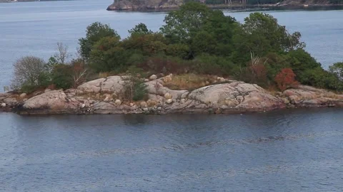 Skerry  with  trees and lighthouse at Baltic sea Stock Footage 182458860