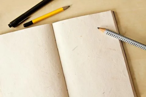 Sketchbook note pad with empty paper page and pencil Stock Photos