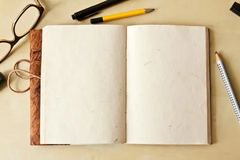Sketchbook note pad with empty paper page and pencil Stock Photos