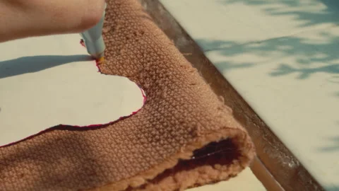 Sketching the Outline of a Bear Pattern on Fabric at Build-A-Bear Workshop - Stock Footage 296278251