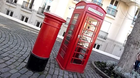 Skew angle of an Iconic Red Post Box and Red  Phone Box in London United kingdom Video stock 47209073