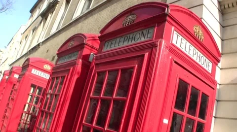 Skew mid shot of a row of Red Telephone Box in London in the United Kingdom Video stock 48599074