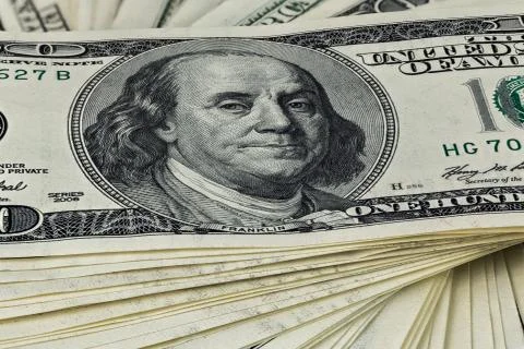 A skewed stack of old us dollar banknotes - close shot Stock Photos