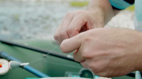 Skewer a worm on a hook. Cinema camera footage Stock Footage 65480242