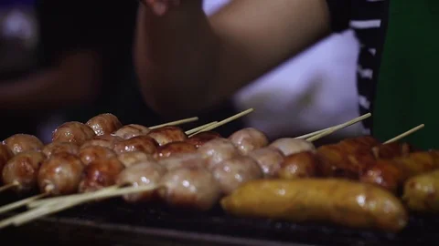 Skewered sausages are cooked on the grill Stock Footage 110894341