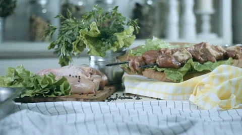 Skewers and chicken on the table Stock Footage 68721987