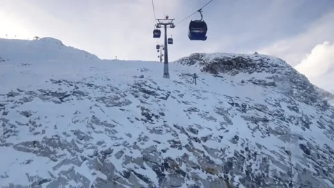 Ski cable car ride above the clouds on a glacier Stock Footage 223200730