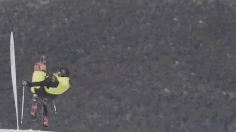 Ski competitor performs tricky jump. Stock Footage 81882435