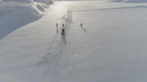 Ski-doo pull skiing on snow surface aerial view Stock Photos