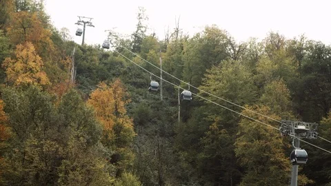 Ski elevator cable way for people transportation on summer mountain. Chairlift Stock Footage 118642506