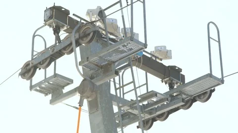 Ski elevator on snow mountain at ski winter resort close up. Ski lift on ropeway Stock Footage 88426659