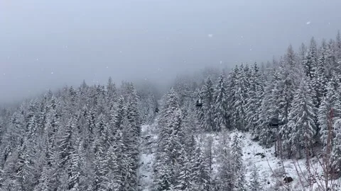 Ski gondolas of Courchevel ski resort in French alps on a snowy day Stock Footage 337093834