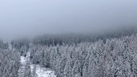 Ski gondolas of Courchevel ski resort in French alps on a snowy day Stock Footage 337095368
