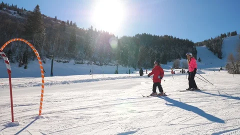 Ski instructing for kids in the ski school at the mountain resort Stock Footage 111762311