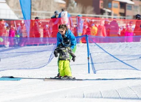 Ski Instructor with 3-Year Old Toddler Boy at a Mountain Resort Stock Photos