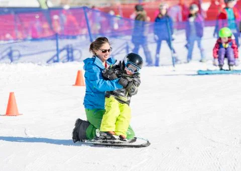 Ski Instructor with 3-Year Old Toddler Boy at a Mountain Resort Stock Photos