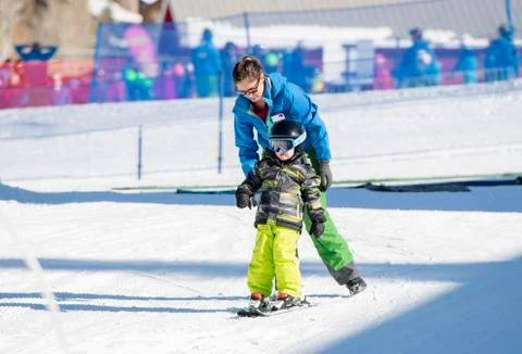 Ski Instructor with 3-Year Old Toddler Boy at a Mountain Resort Stock Photos