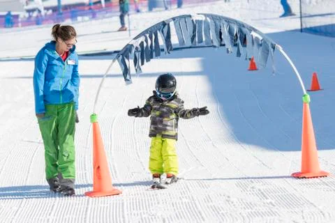 Ski Instructor with 3-Year Old Toddler Boy at a Mountain Resort Stock Photos