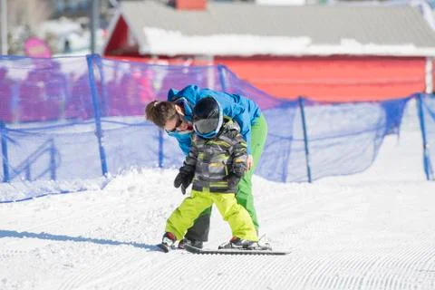 Ski Instructor with 3-Year Old Toddler Boy at a Mountain Resort Stock Photos