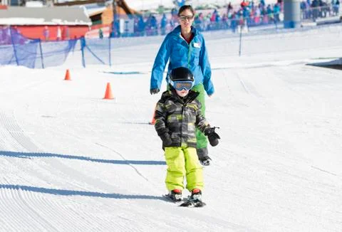 Ski Instructor with 3-Year Old Toddler Boy at a Mountain Resort Stock Photos
