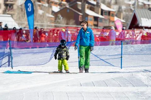 Ski Instructor with 3-Year Old Toddler Boy at a Mountain Resort Stock Photos