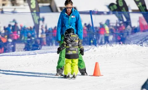 Ski Instructor with 3-Year Old Toddler Boy at a Mountain Resort Stock Photos