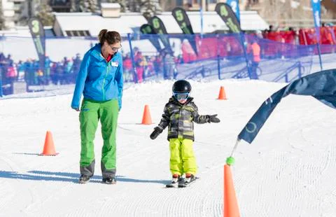 Ski Instructor with 3-Year Old Toddler Boy at a Mountain Resort Stock Photos