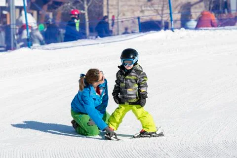 Ski Instructor with 3-Year Old Toddler Boy at a Mountain Resort Stock Photos