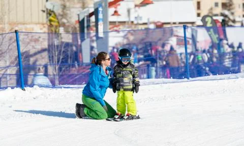 Ski Instructor with 3-Year Old Toddler Boy at a Mountain Resort Stock Photos