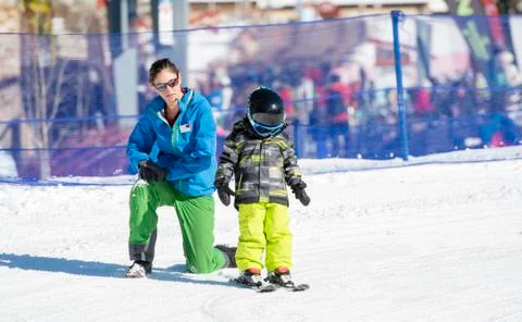 Ski Instructor with 3-Year Old Toddler Boy at a Mountain Resort Stock Photos