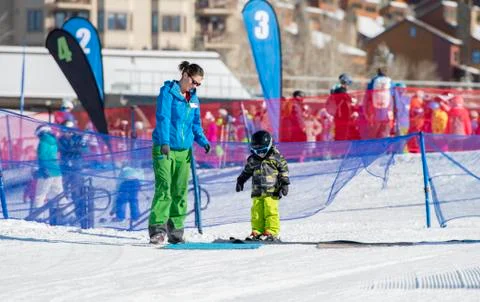Ski Instructor with 3-Year Old Toddler Boy at a Mountain Resort Stock Photos