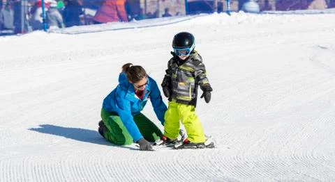 Ski Instructor with 3-Year Old Toddler Boy at a Mountain Resort Stock Photos