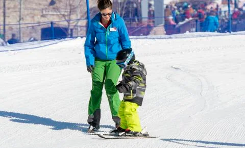 Ski Instructor with 3-Year Old Toddler Boy at a Mountain Resort Stock Photos
