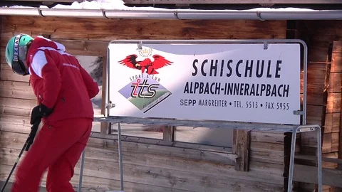 SKI INSTRUCTOR WARMING UP Stock Footage 121444681