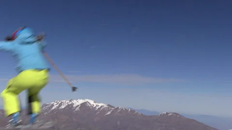 Ski jump with mountain and blue sky in background 스톡 동영상 33648598