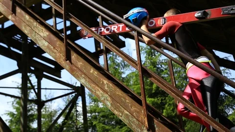 Ski jumper is getting ready for a jump Stock Footage 98642985