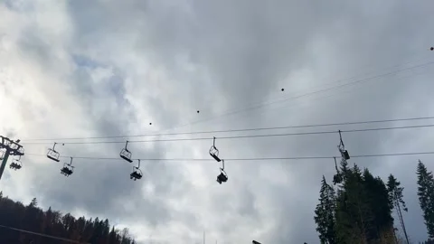 Ski lift on the background of the sky with gray clouds. Stock Footage 255683793