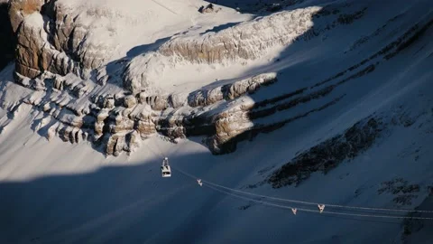 Ski lift cabins in winter time in Glacier 3000, Swiss Alps. Beautiful mountains Stock Footage 224537421