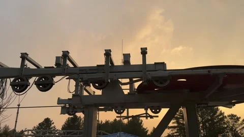 Ski Lift Close Up of Rollers, Pulleys, and wheel in sunset lighting. Stock Footage 296882887