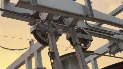Ski Lift Close Up of wheels with cable with chairlift(cable car) passing by. Stock Footage 296882750